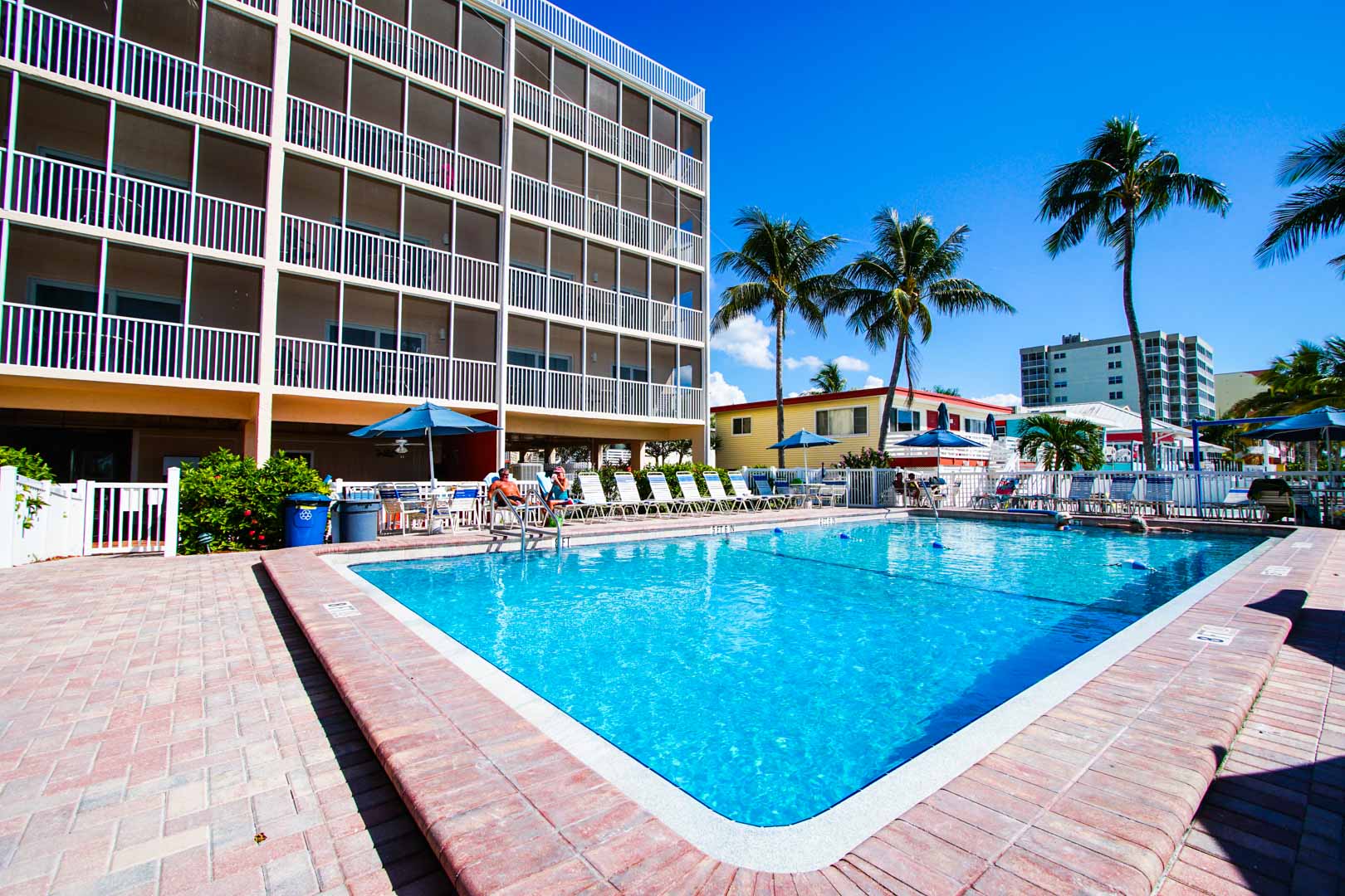 A crisp outdoor swimming pool at VRI's Windward Passage Resort in Fort Myers Beach, Florida.